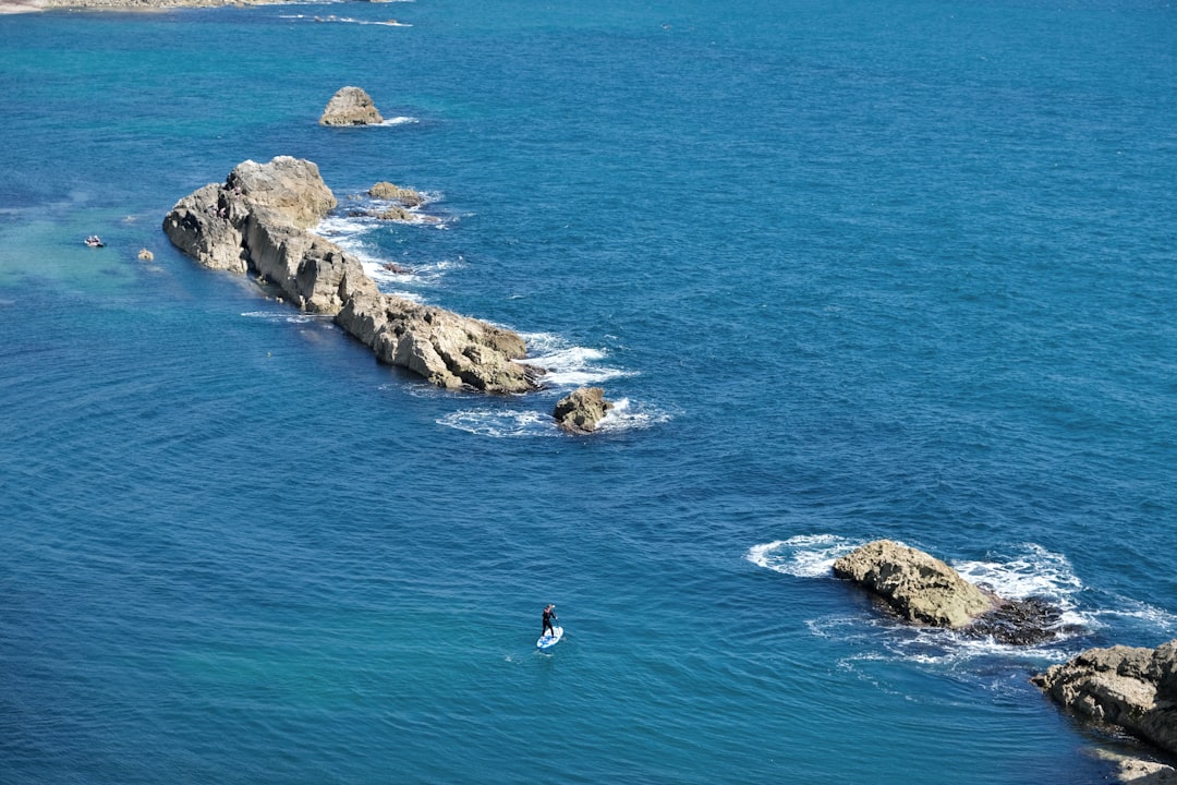a person surfing in the sea